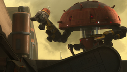 Chopper caught in the grip of a dismantler droid.