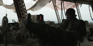 Dhowar Repareed sits with his feet up on a counter in the Bis Refinery control tower.