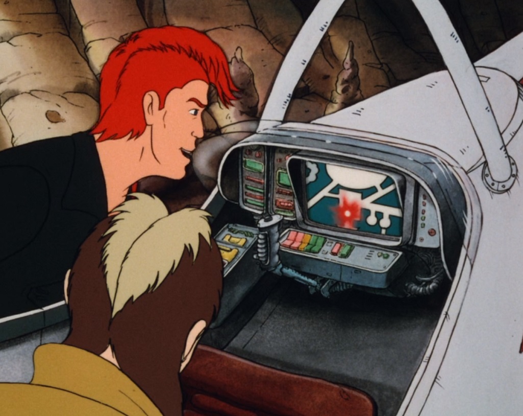 Thall Joben and Kea Moll look at a monitor in the White Witch's cockpit.