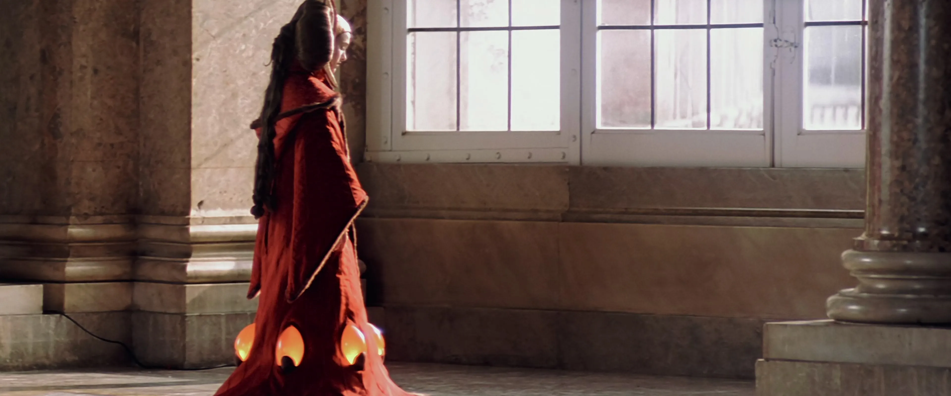 Queen Amidala mournfully watches the Fall of Theed.