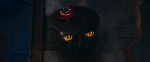 TT-8L-OT retracts back into the Olega Jedi temple wall with a flashing red restrining bolt attatched to its head.