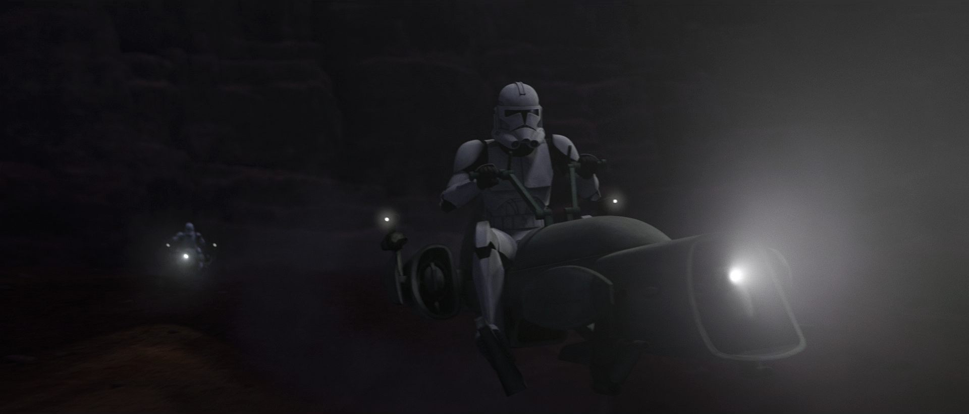 Clone troopers riding BARC speeders approach Cham Syndulla's position.