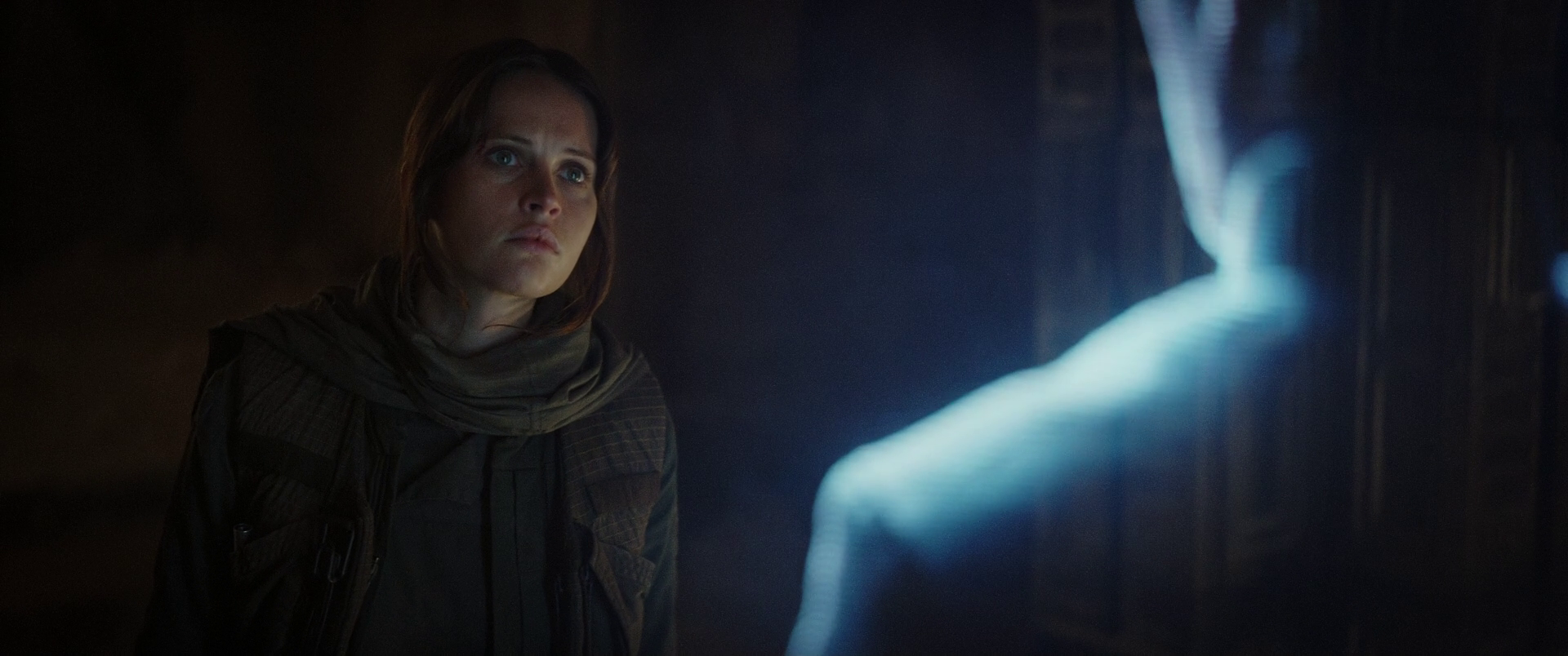 Jyn watches her father's holographic message.