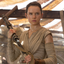 Rey holds her quarterstaff