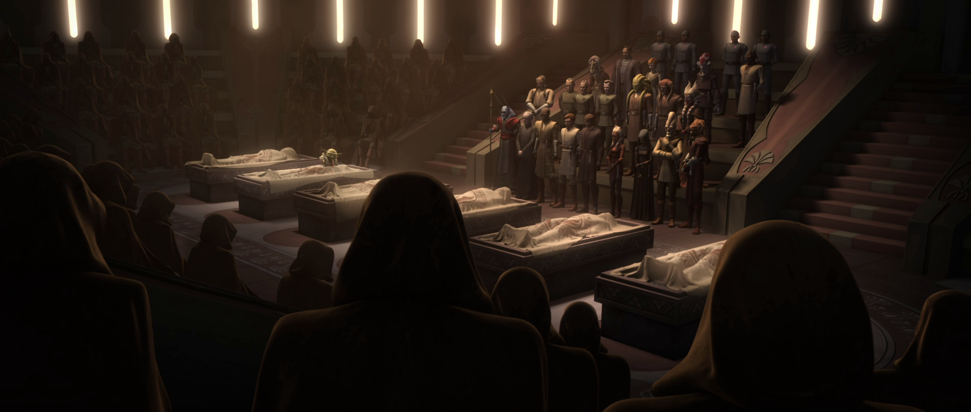 Mundi attends the funeral for the six deceased Jedi.