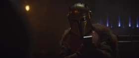 The Armorer inspects the bar of beskar