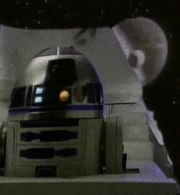 Death Star III behind R2-D2, on a StarSpeeder 3000 video screen