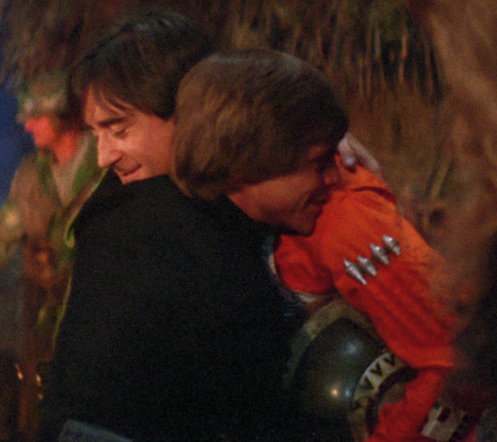 Antilles embraces his close friend Skywalker while celebrating the Rebellion's victory at Endor.