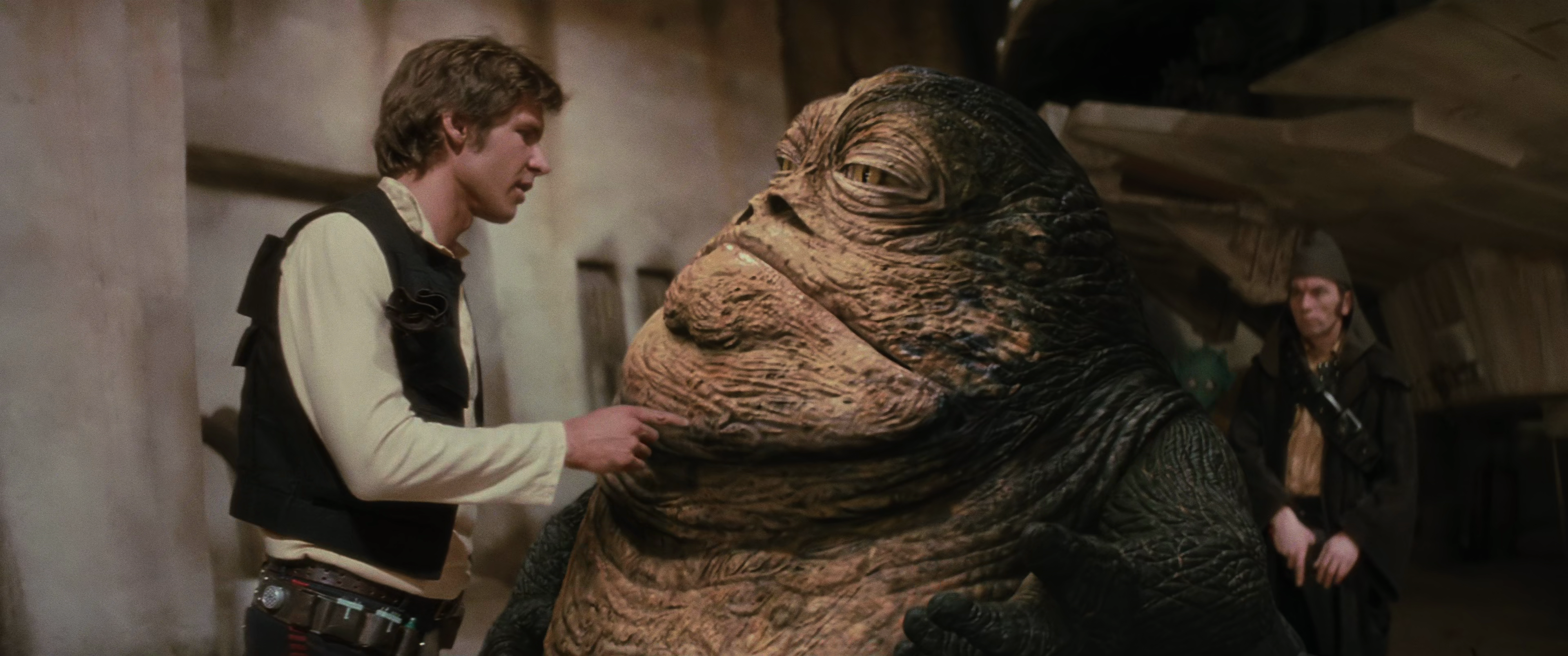 Jabba the Hutt talks to Solo.