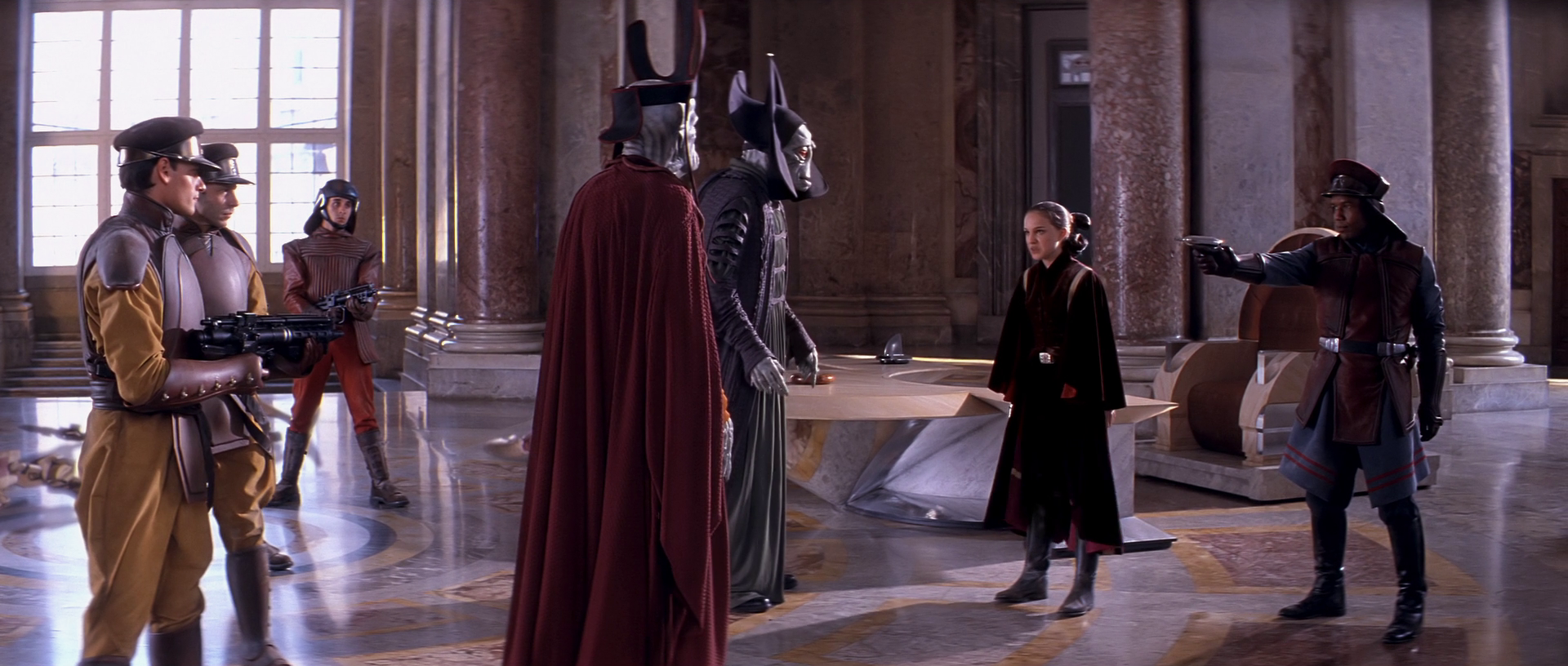 Amidala "discusses" a new treaty with Gunray.