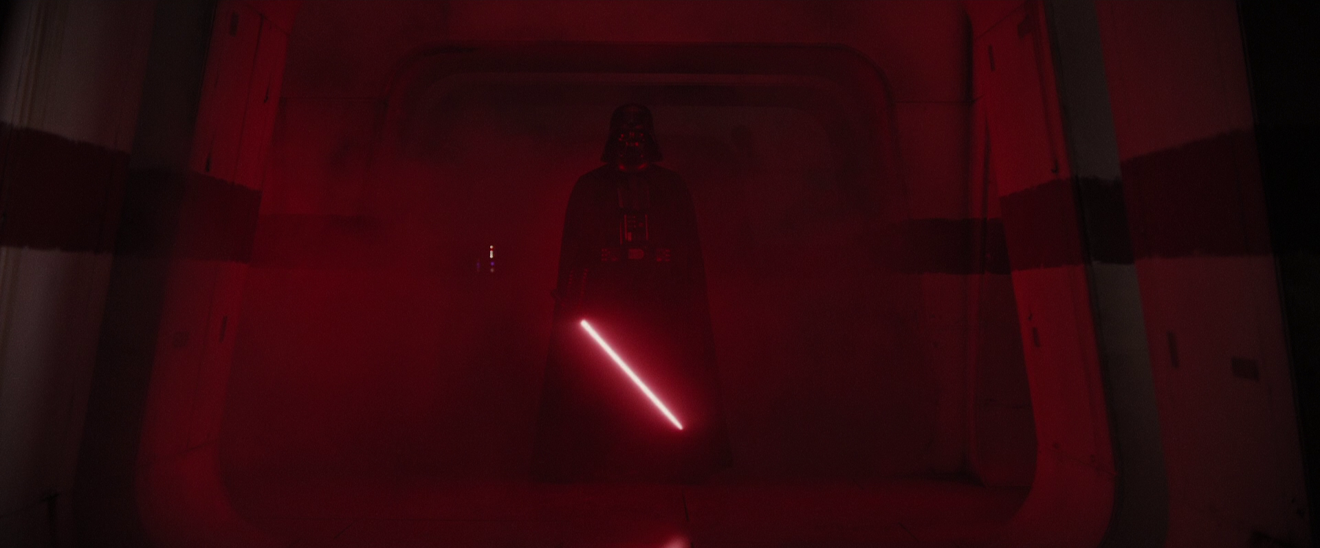 In accordance with Sith tradition, Darth Vader bled a kyber crystal from another Jedi's lightsaber, causing its lightsaber to produce a crimson blade.