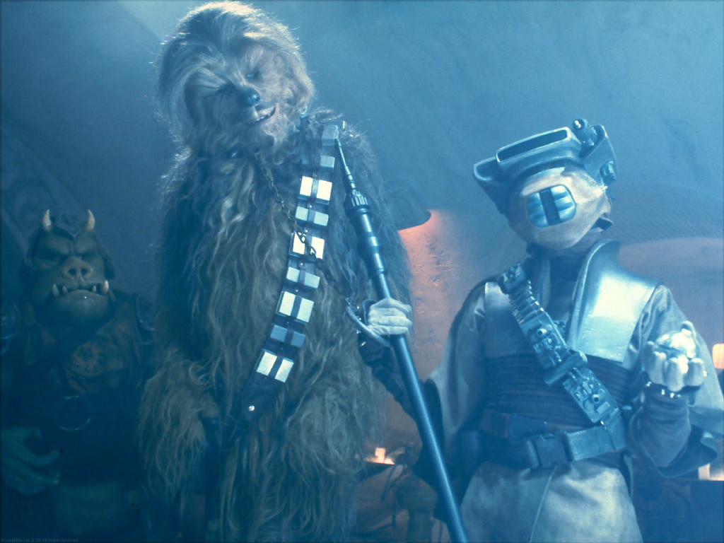 Leia, disguised as Boushh, negotiates Chewbacca's bounty