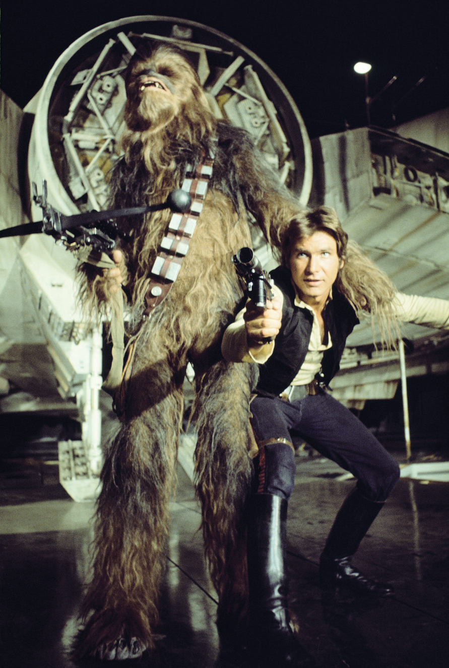 Han Solo wielding his blaster alongside his partner, Chewbacca