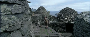Rey enters the Jedi village in search of Luke Skywalker.