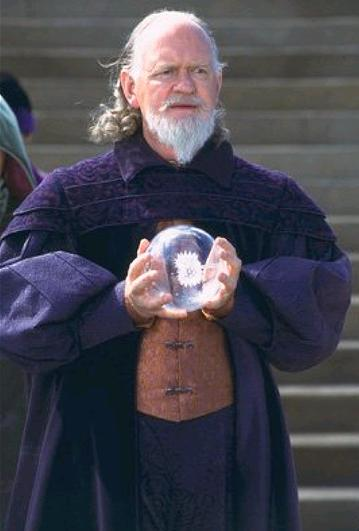 Oliver Ford Davies (playing Governor Sio Bibble) holding a glass ball—which was transformed into the Globe of Peace in postproduction