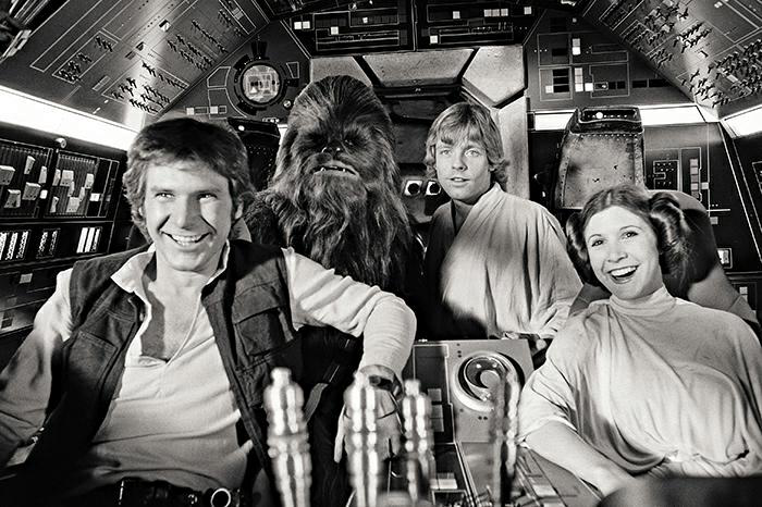 Harrison Ford and his co-stars relax on the set of Star Wars.