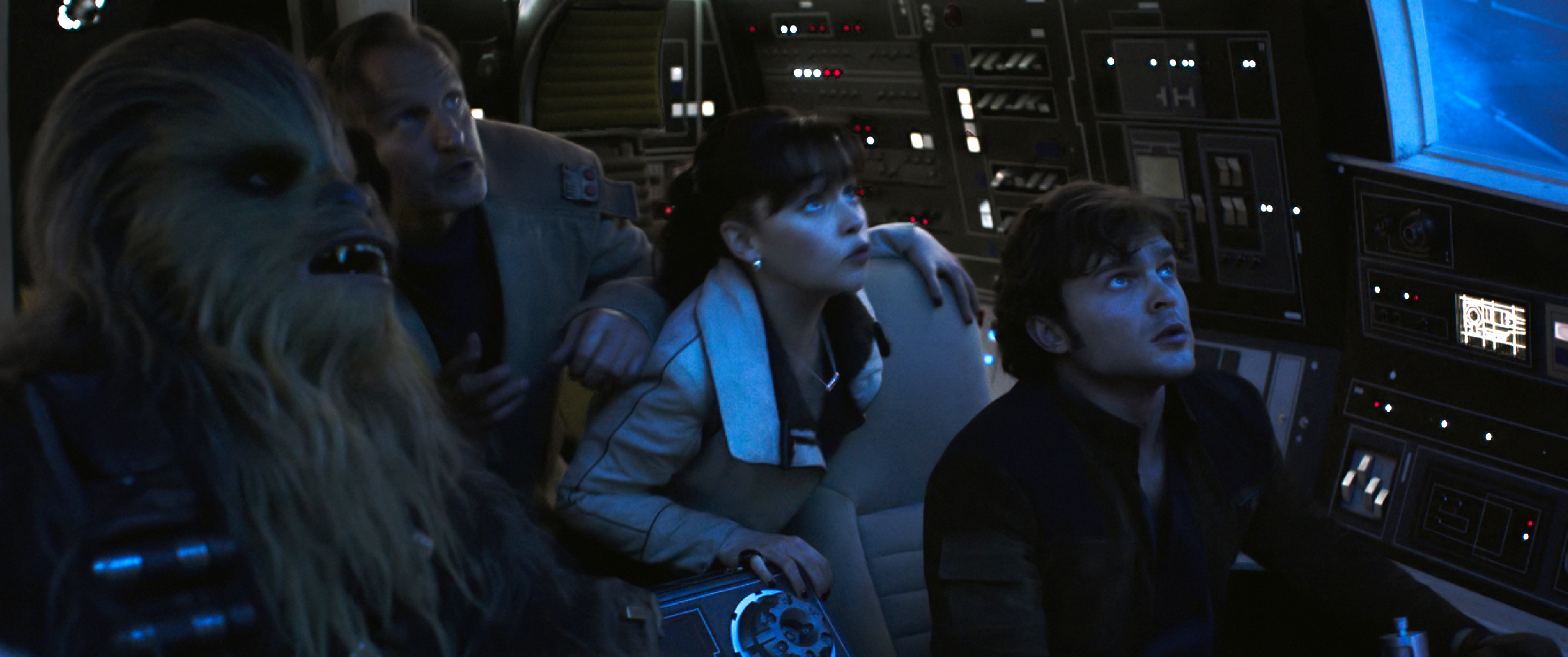 Chewbacca, Beckett, Qi'ra, and Solo aboard the Millennium Falcon