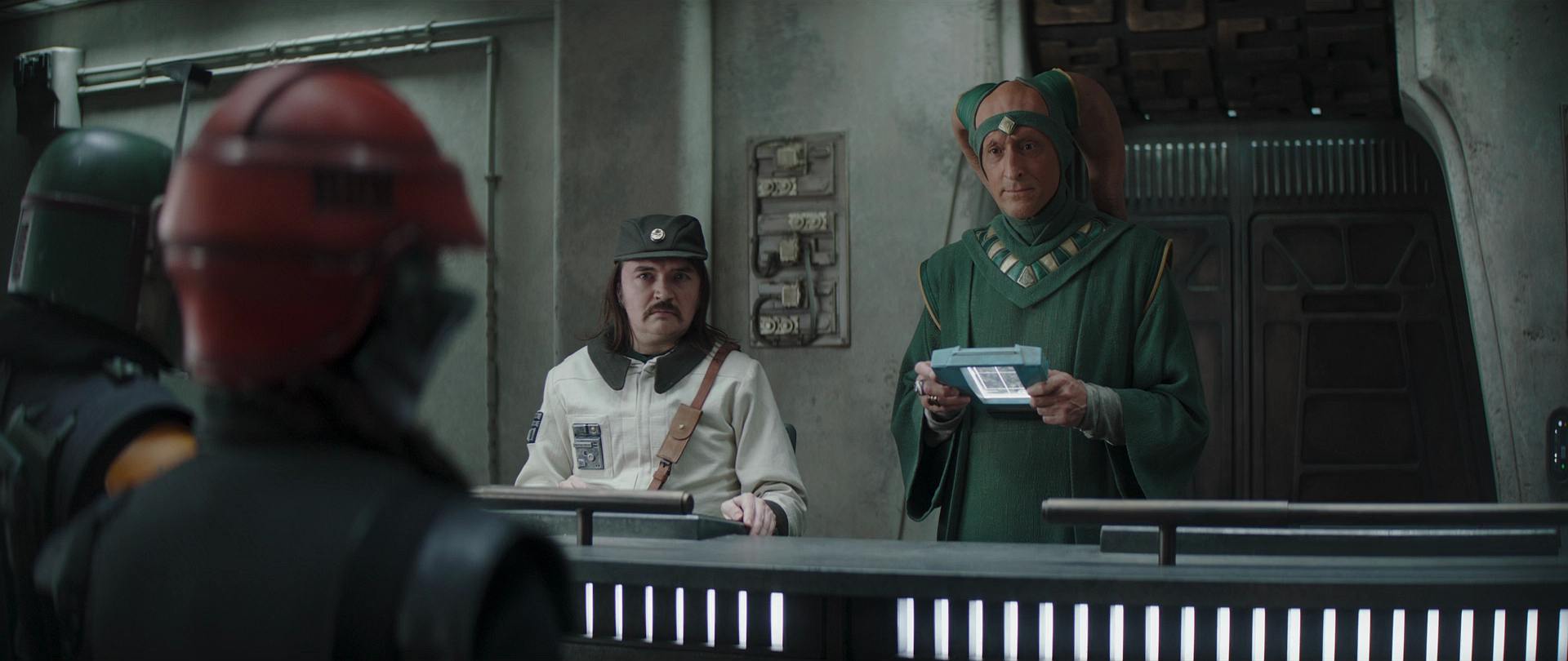 The clerk and majordomo are confronted by Boba Fett and Fennec Shand