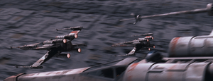 A trio of Rebel X-wing starfighters approach the surface of the Death Star.