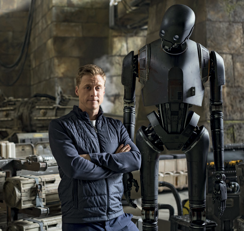 Alan Tudyk on the set of Rogue One with his alter ego, K-2SO.