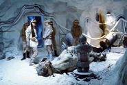 2-1B attends to the dead tauntaun