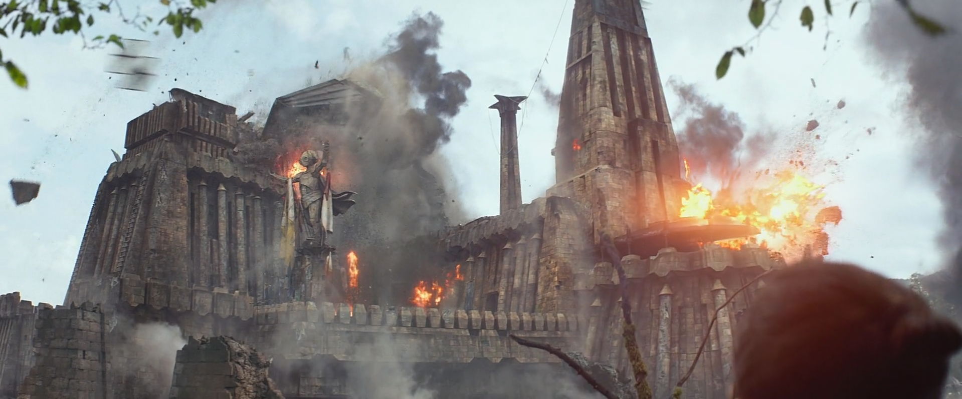 Rey watches as Maz Kanata's castle is fired upon by the First Order.