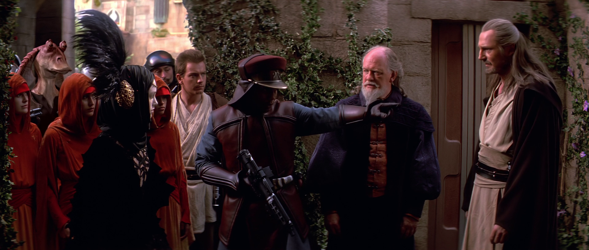 The Jedi liberate the queen and her guards from the battle-droid invasion.