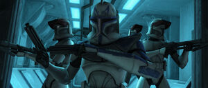 Rex and his troops await Anakin Skywalker and Ahsoka Tano on their escape shuttle.