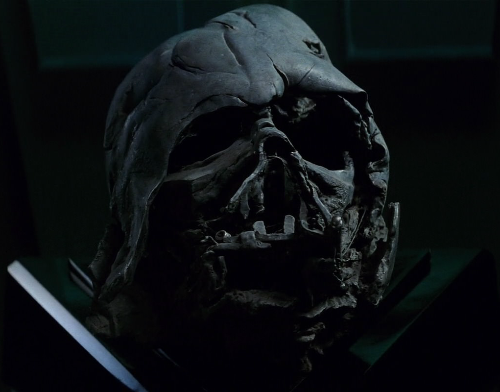 The charred remains of Darth Vader's helmet, scavenged from the funeral pyre on Endor