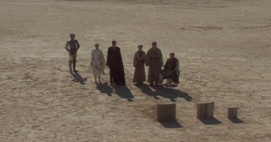 C-3PO, Padmé Amidala, Anakin Skywalker, Beru, Owen, and Cliegg at Shmi's funeral.