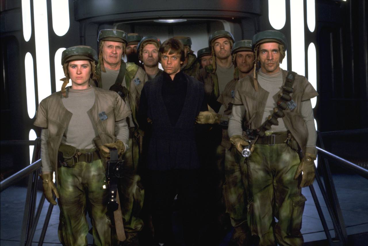 One of the promotional photos of Beezer and other strike team members, shown standing aboard the Death Star with Luke Skywalker