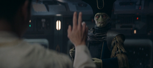 Yord Fandar raises a hand toward a surprised looking Blex on the bridge of the Fallon.