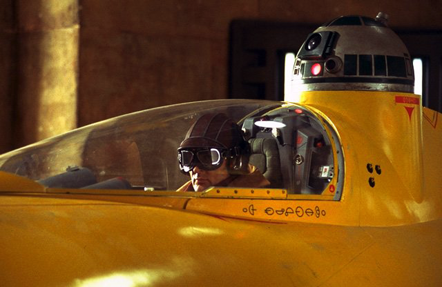 Olié in his N-1 starfighter with his astromech droid.