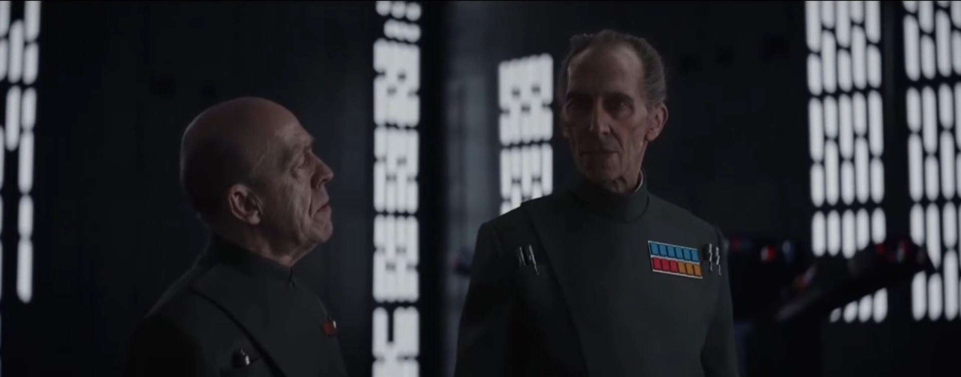 Romodi and Tarkin discussing the Battle of Scarif.