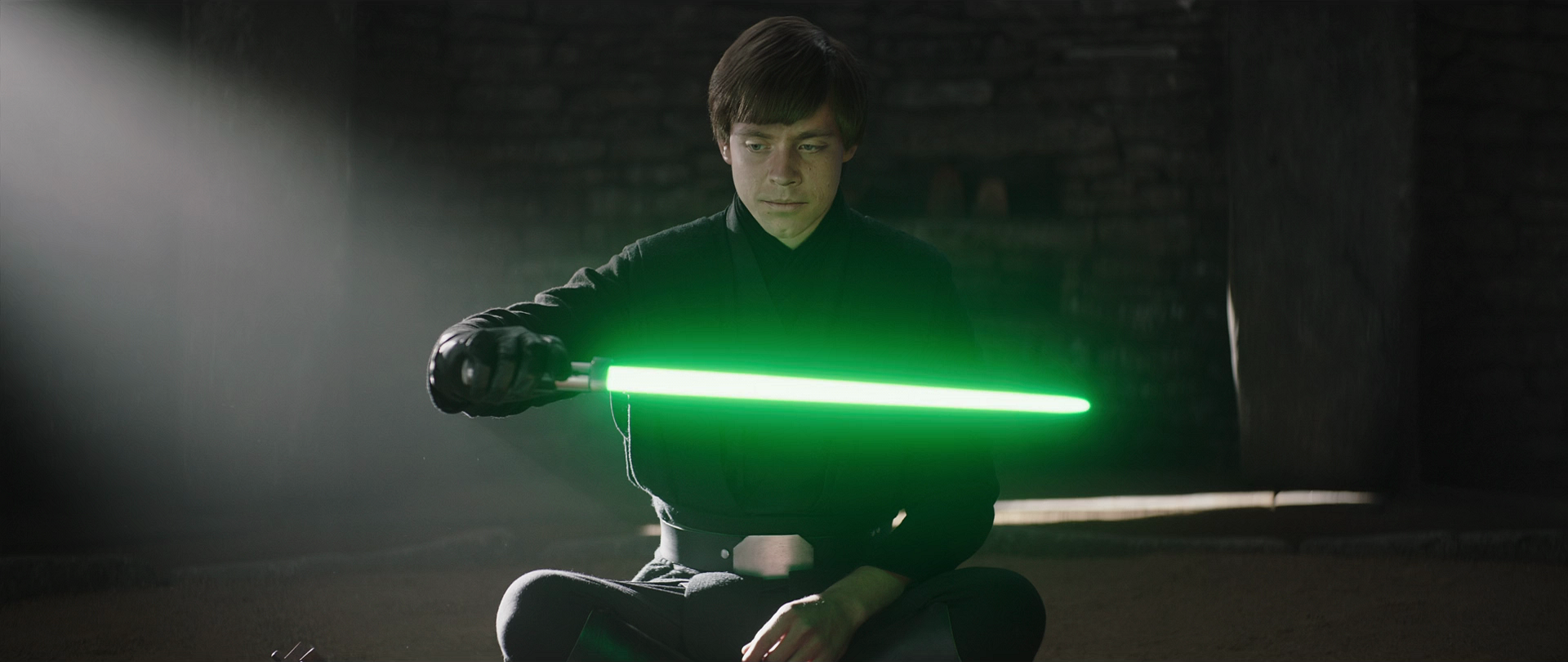 Skywalker showing Grogu Master Yoda's old lightsaber