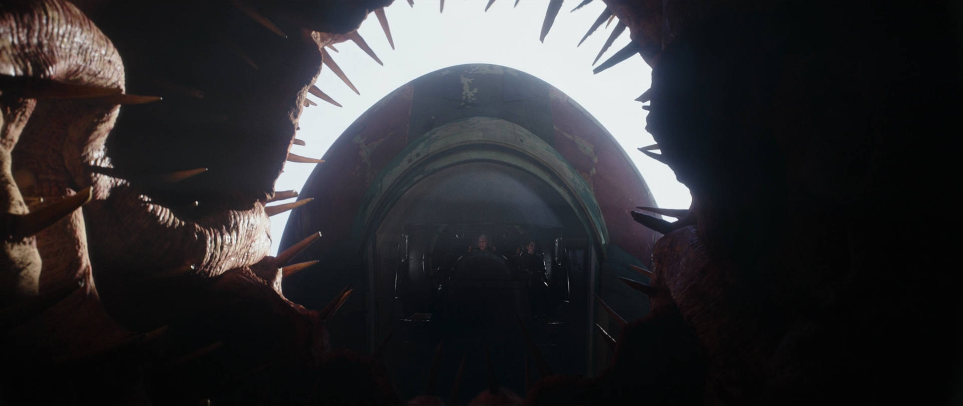 Slave I hovers over the maw of the sarlacc pit.