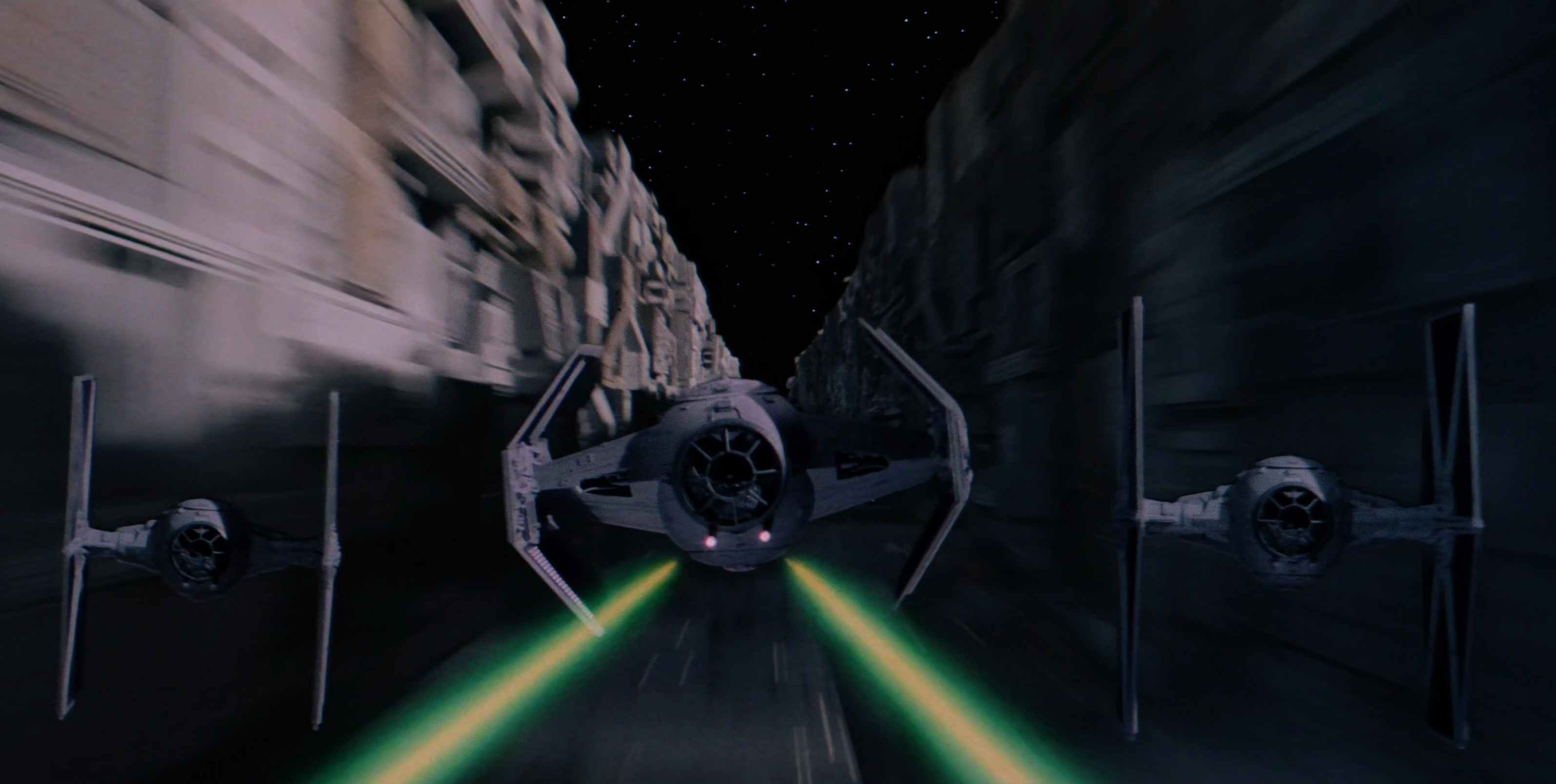 Vader pursuing Rebel fighters in the Death Star trench.