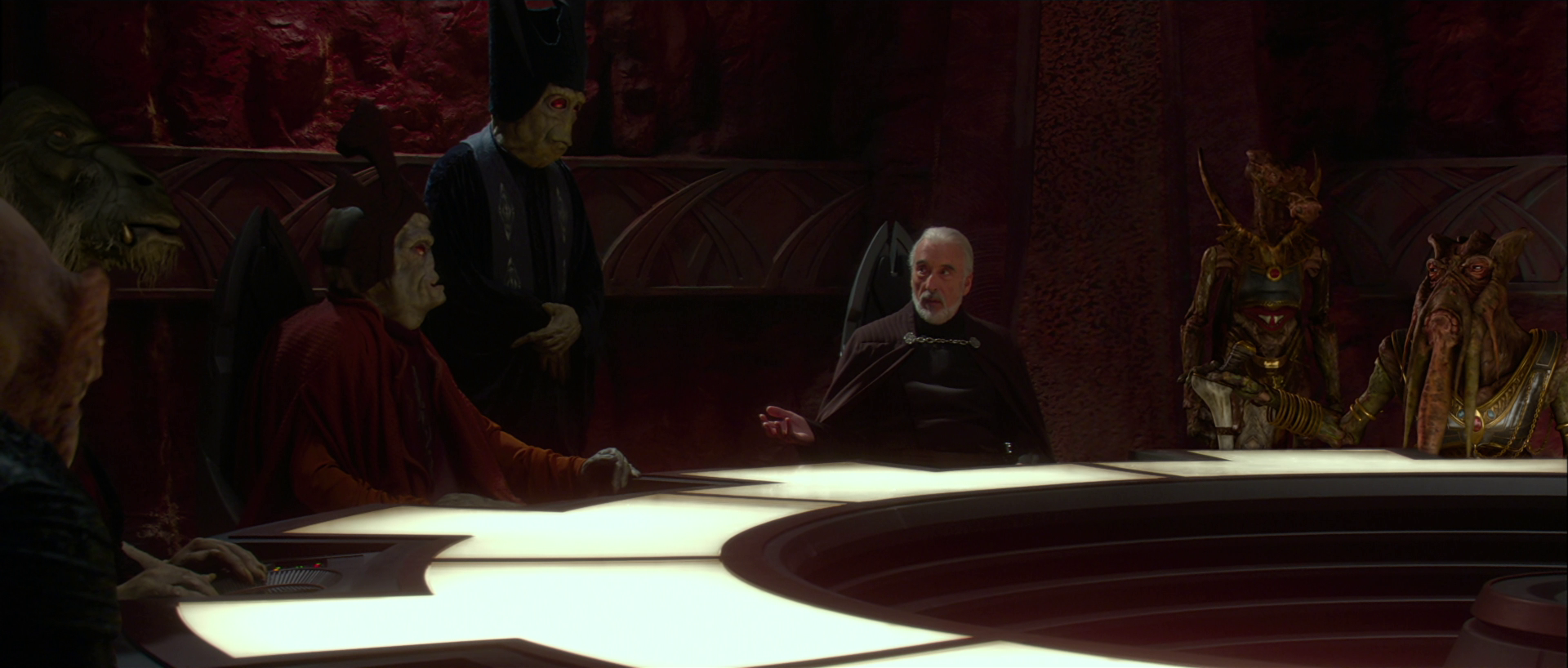 Head of State Dooku meeting with delegates from various interstellar conglomerates during a summit held on Geonosis.