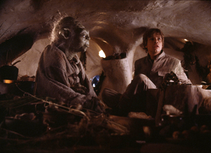 Luke Skywalker joins Yoda for dinner within the Jedi Master's hut.