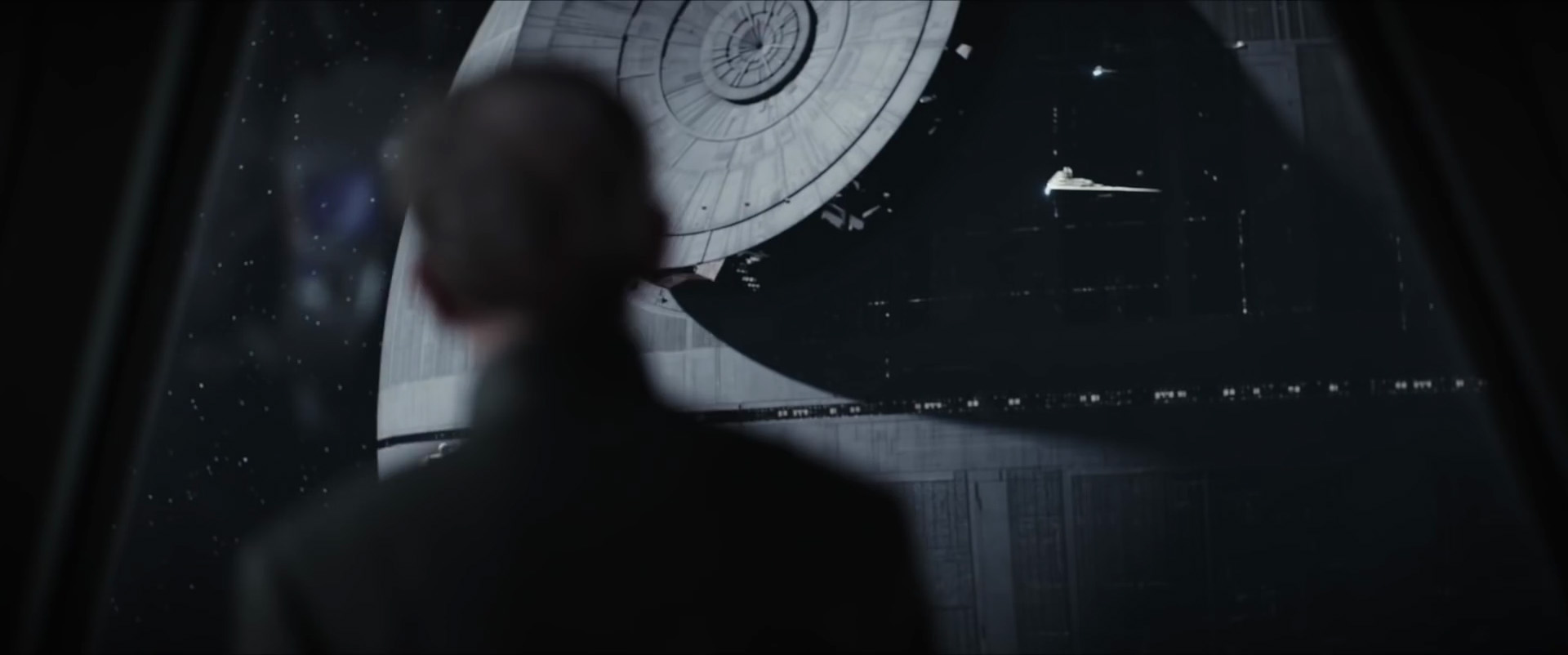 Tarkin watches as the Death Star's superlaser is installed.