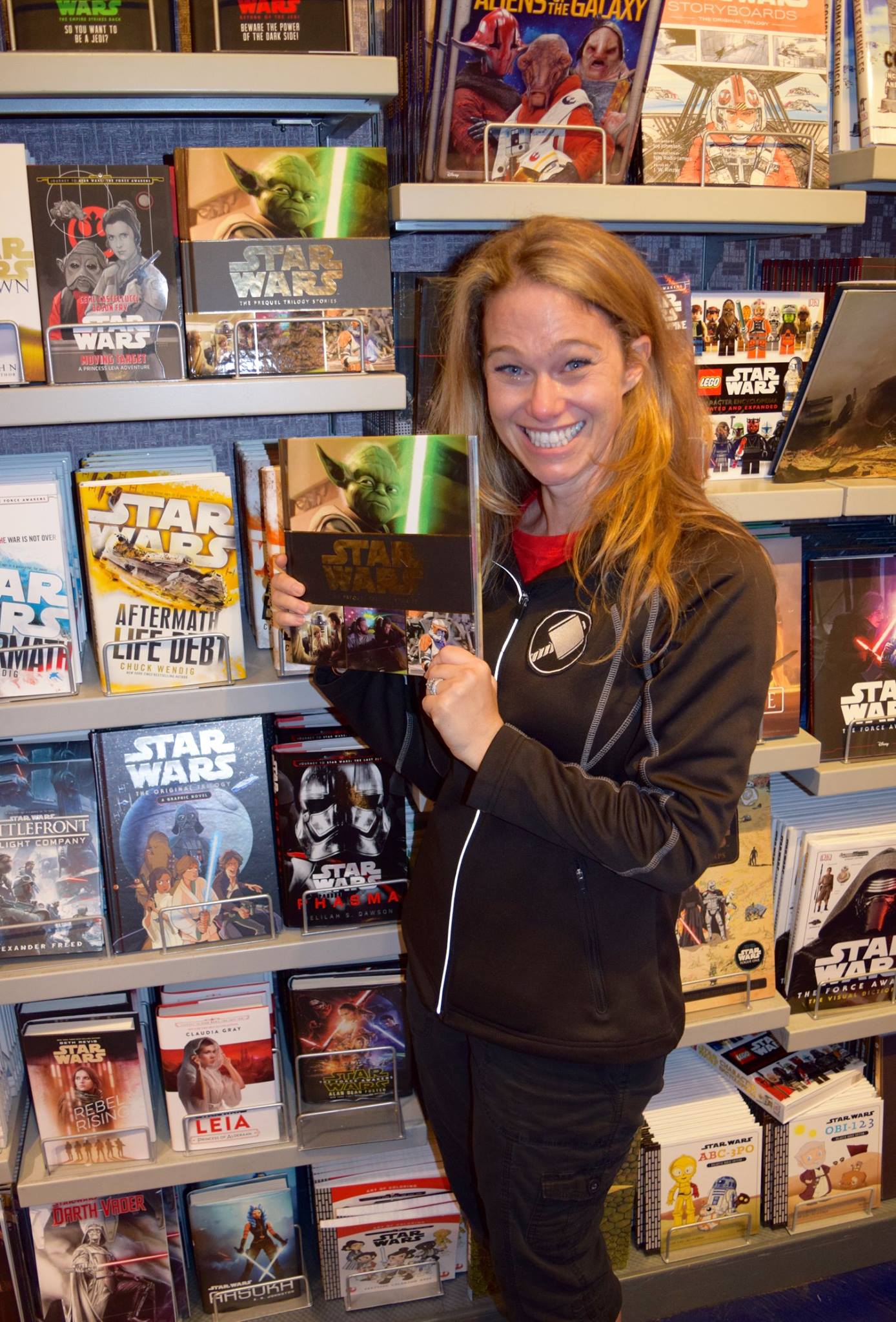 S.T. Bende with a copy of The Prequel Trilogy Stories at a store in Disneyland