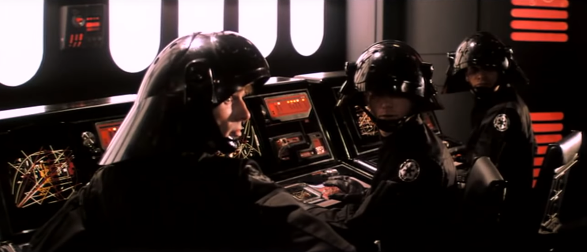 Death Star troopers sitting at a row of computer terminals