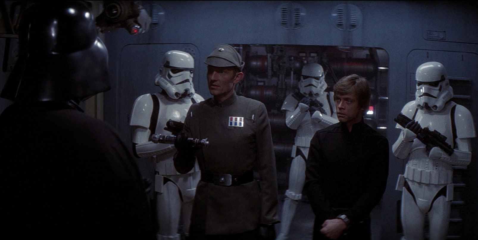 Igar handed Luke Skywalker's lightsaber over to Darth Vader.