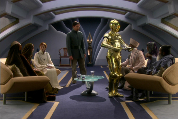 C-3PO serves drinks at a meeting of the Delegation of 2000.