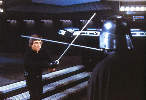 Mark Hamill and Bob Anderson on set fighting with carbon fiber rods in Return of the Jedi.