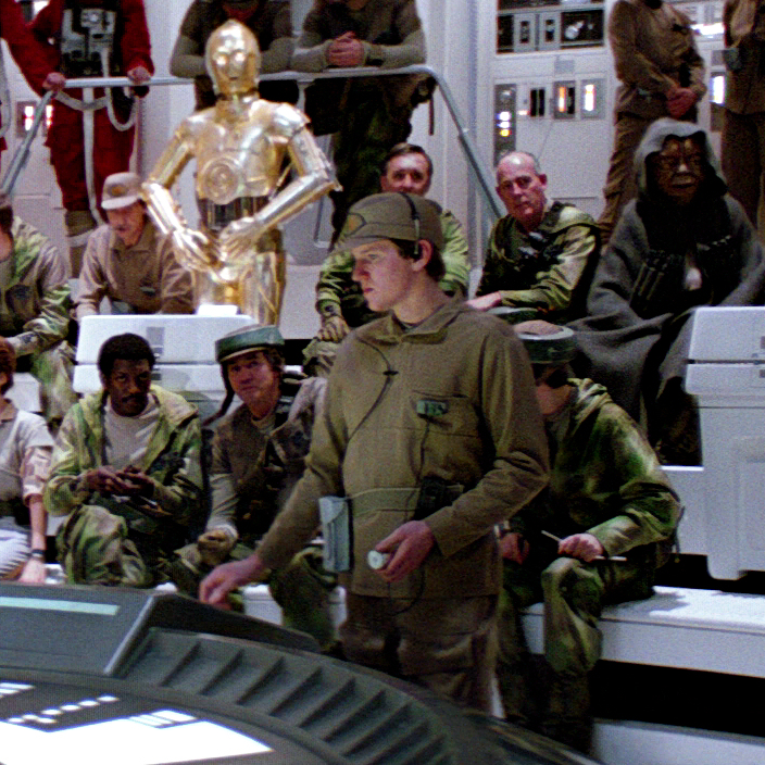 Delevar (third from left, front row) attends the briefing on the Endor mission aboard Home One