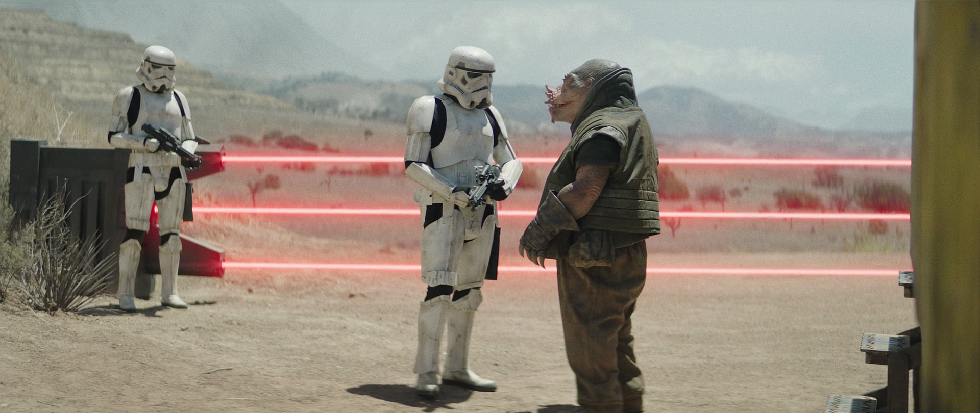 Freck speaks to the stormtrooper at the Imperial checkpoint.