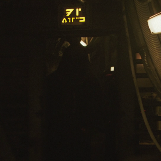 "D7 X371K" written in Aurebesh over a gate on Kessel in the movie Solo: A Star Wars Story, using alternate Aurebesh numerals originally created for Platt's Starship Guide