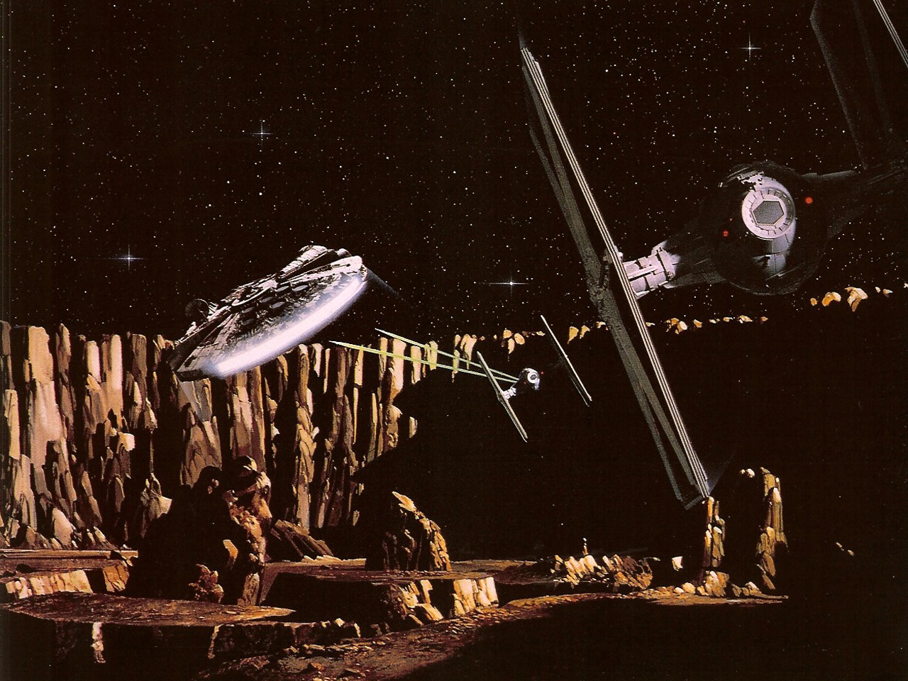 TIE Fighters pursue the Millennium Falcon across one of the larger asteroids.