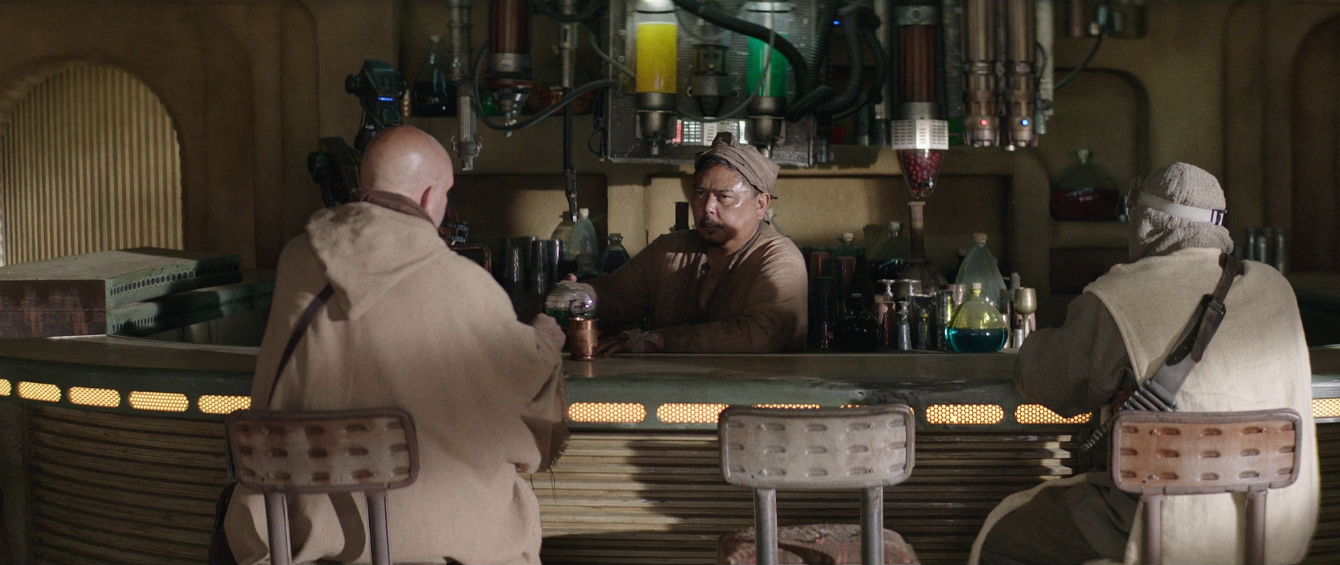 The saloon owner tends the bar in his establishment.